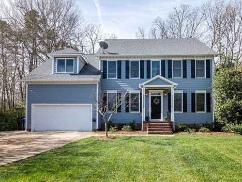 Blue house with garage in well kept neighborhood